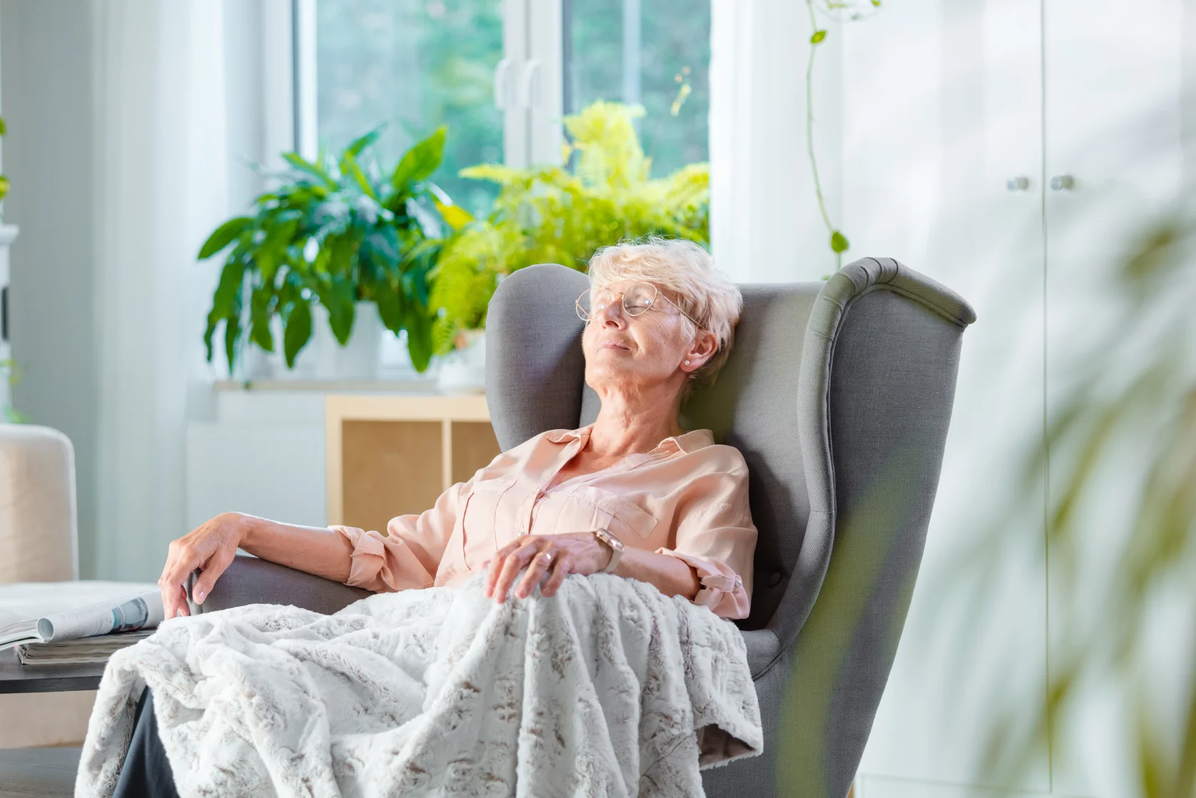 elderly woman sitting in chair and relaxing